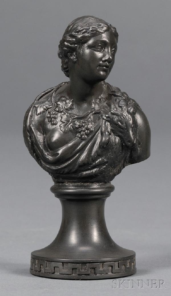 Miniature Wedgwood and Bentley Black Basalt Bust of : Miniature Wedgwood and Bentley Black Basalt Bust of Ariadne, England, 18th century, mounted atop a waisted circular socle, impressed mark, ht. 4 in. Note: As mentioned in Ars Ceramica, 1994, it is pos