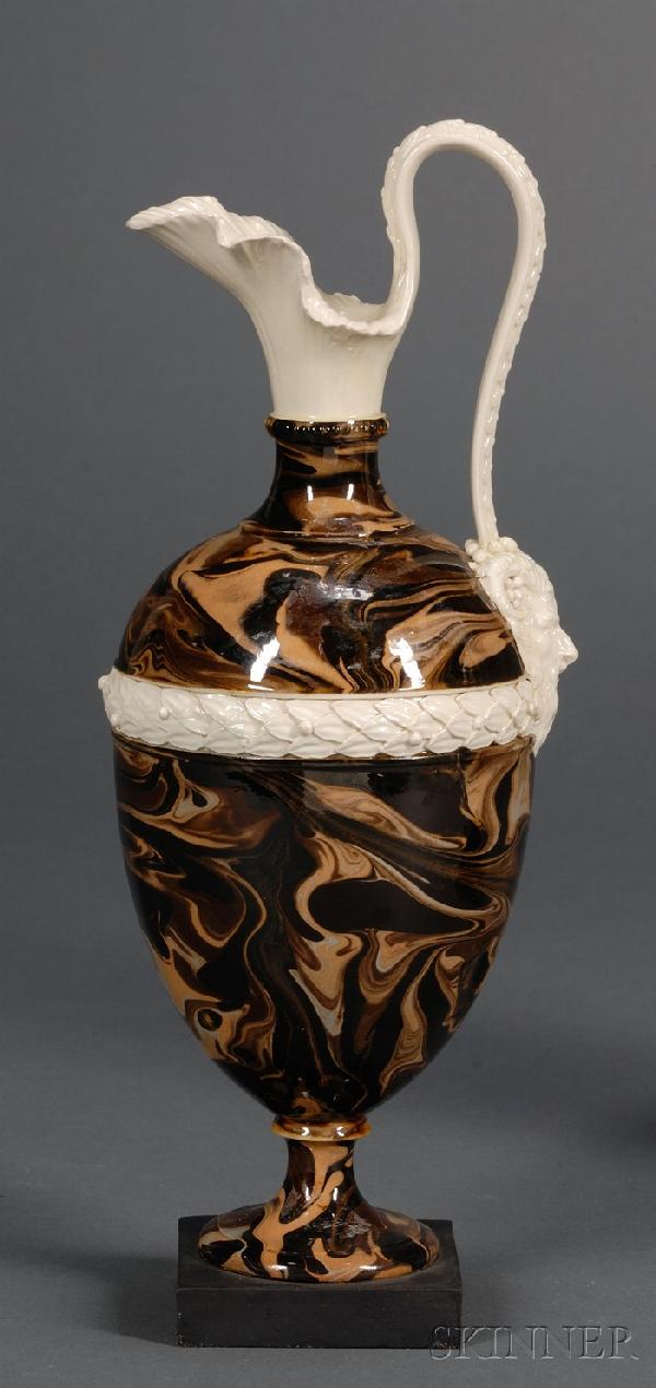 Wedgwood and Bentley Surface Agate Oenochoe Ewer, E: Wedgwood and Bentley Surface Agate Oenochoe Ewer, England, 18th century, creamware body with marbled slip, foliate molded spout with a laurel molded handle terminating at a satyr mask, central laurel 