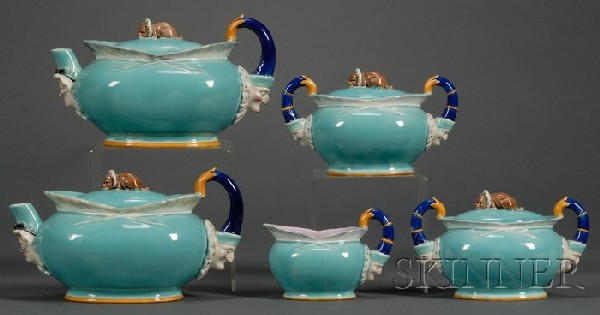 Wedgwood Majolica Five-piece Punch and Judy Patter: Wedgwood Majolica Five-piece Punch and Judy Pattern Assembled Tea Set, England, c. 1879, polychrome decorated, each of oval shape and modeled with figural handles, the covers with "Toby" finials, incl