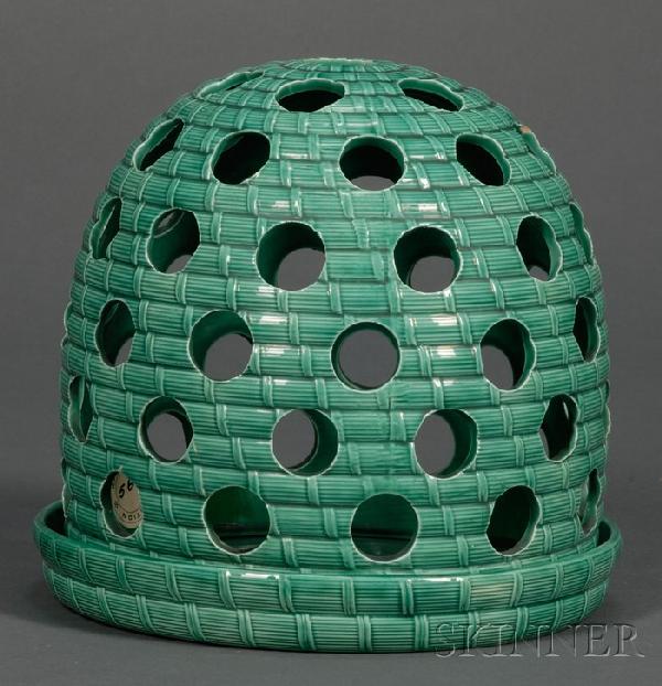 Wedgwood Green Glazed Crocus Pot and Stand, Englan: Wedgwood Green Glazed Crocus Pot and Stand, England, c. 1865, pierced dome-shape with molded basketweave ground, impressed mark, ht. 6 1/2 in. Literature: Illustrated in Wedgwood II by R. Reilly, plat