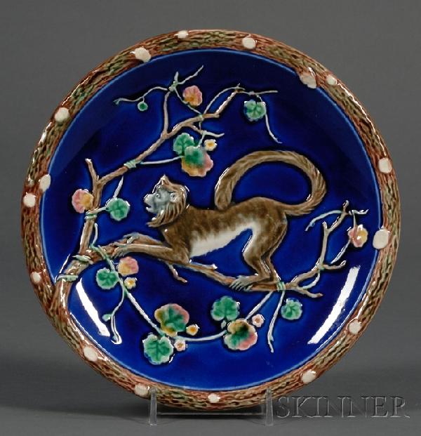 Wedgwood Majolica Monkey Dish, England, c. 1880, p: Wedgwood Majolica Monkey Dish, England, c. 1880, polychrome decorated and molded with a branch border and monkey on a branch center, impressed mark, dia. 8 3/8 in.