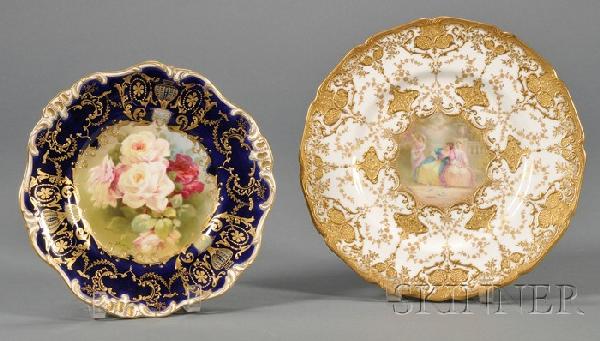 Two Royal Doulton Hand-painted Porcelain Plates, e: Two Royal Doulton Hand-painted Porcelain Plates, early 20th century, a luncheon plate painted to center with a rose bouquet, signed Bentley, with shaped cobalt blue rim with raised gilt decoration acc