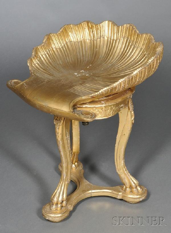 Venetian Giltwood "Grotto" Chair, 19th century, wi: Venetian Giltwood "Grotto" Chair, 19th century, with adjustable shell-shaped seat and foliate carved apron, on cabriole legs and a three-sided concave plinth, ht. 22 1/4 in.