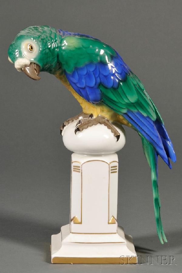 Bavarian Porcelain Model of a Bird, Germany, 20th : Bavarian Porcelain Model of a Bird, Germany, 20th century, polychrome decorated and modeled as a tropical bird perched atop a ball-topped octagonal plinth, ht. 12 in.