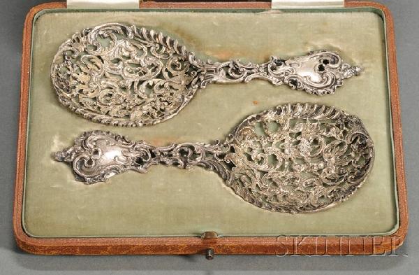 Boxed Pair of Victorian Silver Bonbon Scoops, Lon: Boxed Pair of Victorian Silver Bonbon Scoops, London, 1895, W. Comyns, maker, the Rococo cast and pierced spoons in fitted Mappin & Webb case, spoon lg. 5 5/8 in., approx. 2 troy oz.