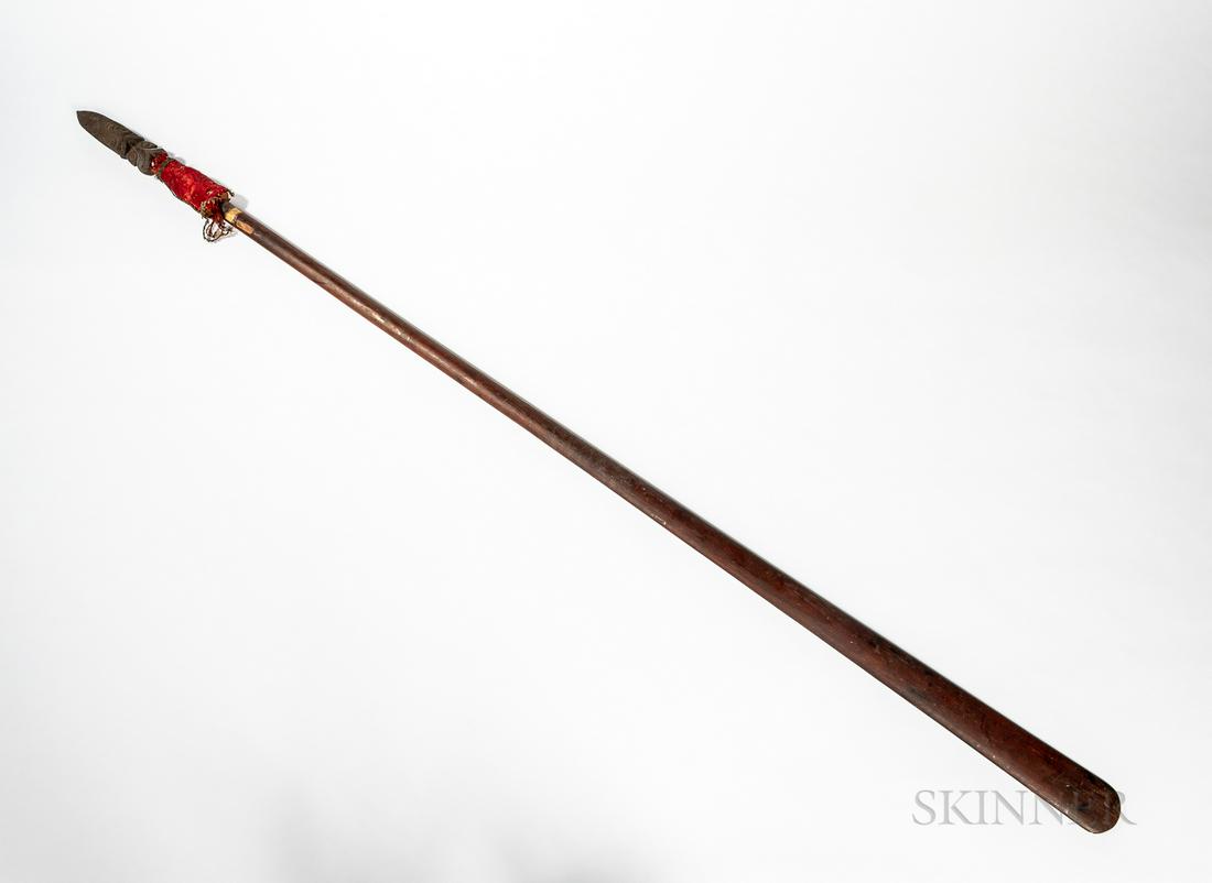 Maori Fighting Staff, Taiaha: Maori Fighting Staff, Taiaha, New Zealand, 19th century, the long shaft with Janus-head finial, the stylized protruding tongue with finely carved scroll design, below a fabric-wrapped cone, (the head 
