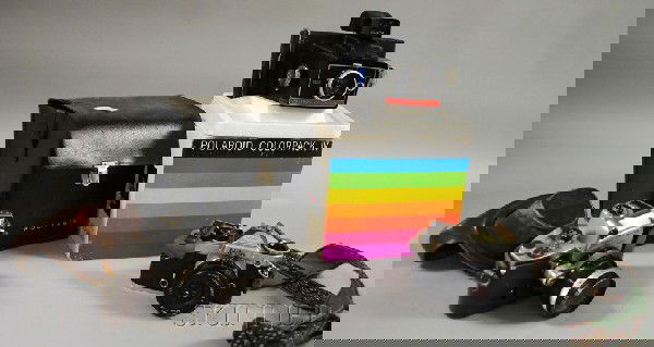 Group of Binoculars, Cameras, and Photographic Acc: Group of Binoculars, Cameras, and Photographic Accessories, four binoculars, three opera glasses, six cameras including Polaroid Colorpack IV, Miranda, Canon, Nikon, and two Kodak.