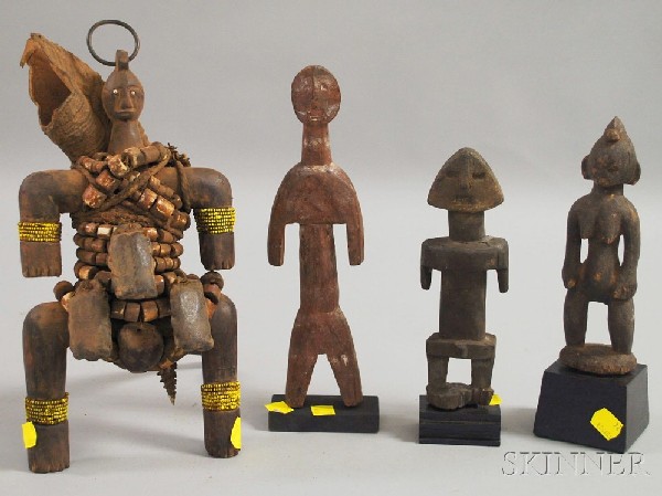 Four African Wood Sculptures, one with horn, leath: Four African Wood Sculptures, one with horn, leather, metal and beadwork, and three standing figures on stands, ht. to 11 1/2 in.