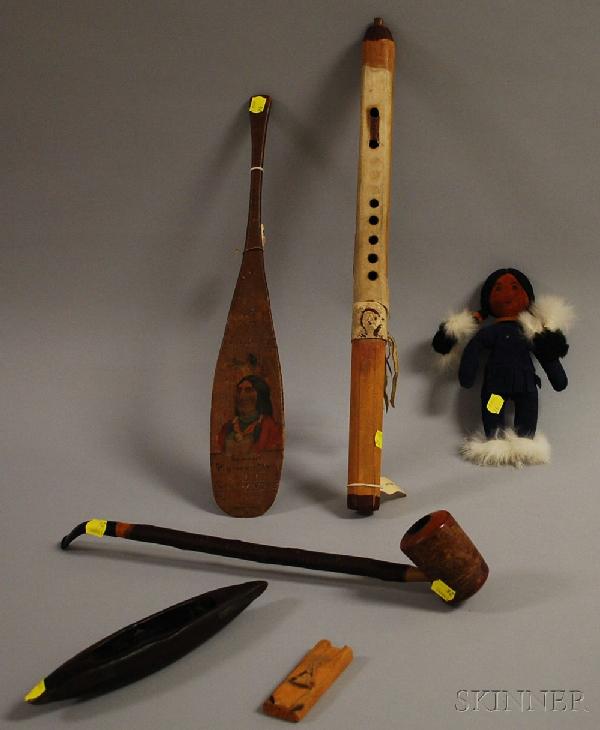 Five American Indian Trading Post Items, a pipe wi: Five American Indian Trading Post Items, a pipe with leather and beadwork, another bark covered pipe, a miniature souvenir paddle with Indian portrait, inscribed Samoset, Plymouth, Mass., a hide cover