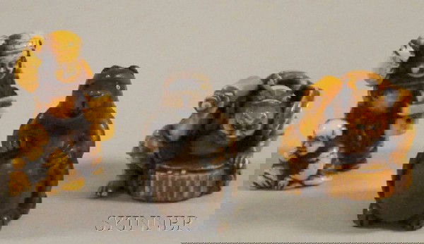 Three 19th-century Japanese Netsuke, an ivory blac: Three 19th-century Japanese Netsuke, an ivory blacksmith holding a tool in his right hand, signed "Tomoshi," an ivory seated old man and standing child, incised signature "Masatoshi," and a boxwood ba