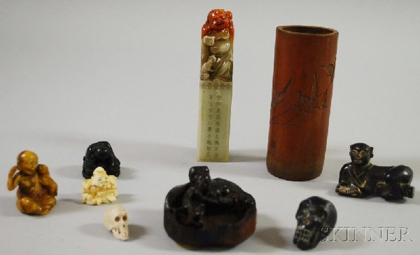 Small Group of Asian Decorative Items, including s: Small Group of Asian Decorative Items, including six netsuke, two depicting skulls; a bamboo brush holder, and other items.
