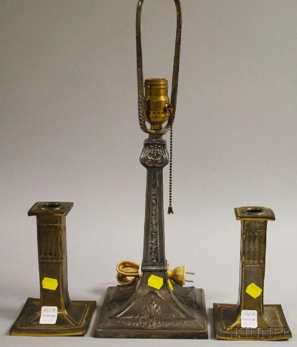 Pair of Pairpoint Arts & Crafts Brass-plated Cand: Pair of Pairpoint Arts & Crafts Brass-plated Candlesticks and a Cast Metal Boudoir Table Lamp Base, the candlesticks with impressed mark and "86120," (plating wear, minor bends), candlestick ht. 6 3/4