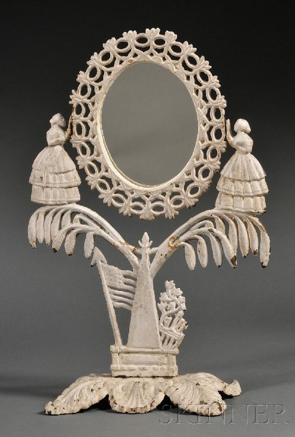 White-painted Cast Iron Jenny Lind Dressing Mirror: White-painted Cast Iron Jenny Lind Dressing Mirror, America, 19th century, the oval mirror frame with pierced oval chain and leaf border swivels between two female figures with hoop skirts on a triang