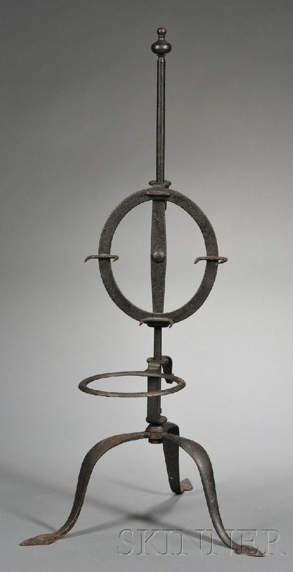Wrought Iron Standing Roaster, America or England,: Wrought Iron Standing Roaster, America or England, with four double-pronged meat holders attached to the vertically sliding frame and ring holder, both with friction springs, tripod base with spade fe