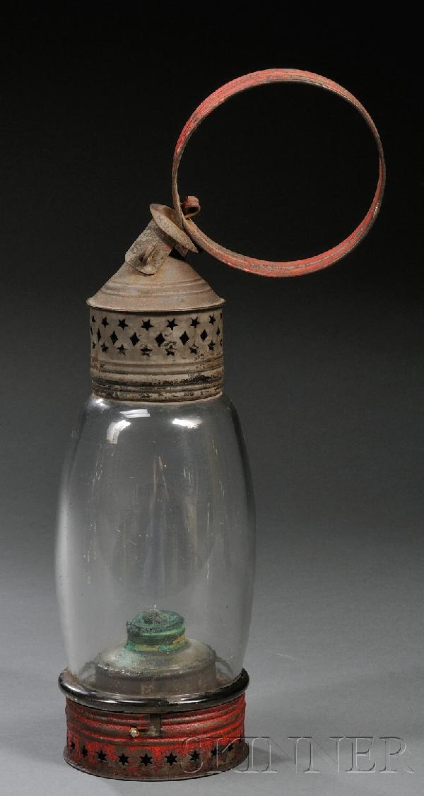 Red-painted Pierced Tin and Glass Lantern, America: Red-painted Pierced Tin and Glass Lantern, America, mid to late 19th century, with ring handle, pierced conical vent and base, fitted with a tin font with whale oil burner, (paint loss), ht. 16 1/2 in