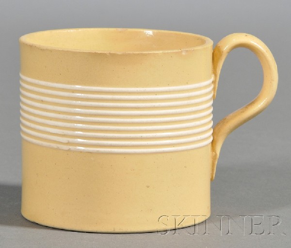 Yellowware Child's Mug, Britain, early 19th centur: Yellowware Child's Mug, Britain, early 19th century, decorated with nine thin white slip bands, (minor rim nicks), ht. 2 1/2 in.