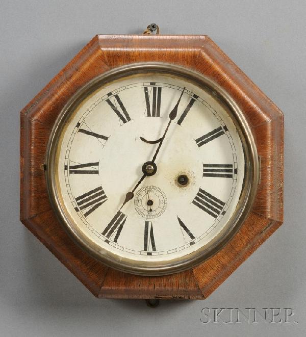 Mahogany Veneer Octagonal Wall Clock by Seth Thoma: Mahogany Veneer Octagonal Wall Clock by Seth Thomas, Thomaston, Connecticut, with paper on zinc Roman numeral dial and one-day lever escapement movement, ht. 11 1/2 in.