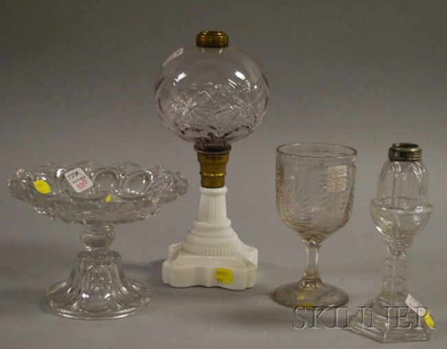 Four Mostly Colorless Pattern Glass Table Items, a: Four Mostly Colorless Pattern Glass Table Items, a colorless blown, molded, and milk glass pressed oil lamp base, a colorless whale oil lamp, compote, and a goblet, including Sandwich and Pittsburgh.
