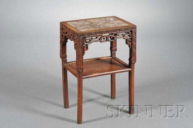 Marble Inset Rosewood Stand, China, 19th century, t: Marble Inset Rosewood Stand, China, 19th century, the rectangular two-layer table with the top inset with a marble plaque, the apron carved in openwork with classic scroll and leafy tendrils, ht. 24 1