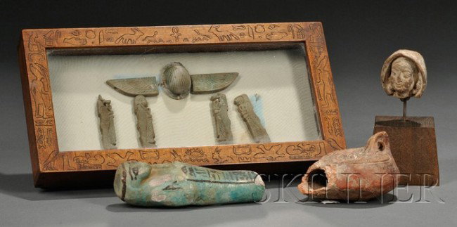 Lot of Assorted Antiquities, Egypt, 4th century B.: Lot of Assorted Antiquities, Egypt, 4th century B.C., six pieces of faience, five amulets in a frame and a ushabti, a lamp and a figurine's head.