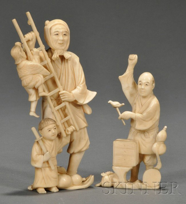 Two Ivory Figures, Japan, 19th century, one as a m: Two Ivory Figures, Japan, 19th century, one as a man holding a ladder with two children, the other as a standing figure of a street performer, ht. 5 3/8, 4 1/4 in.