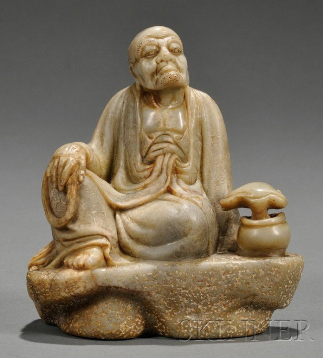 Soapstone Carving, China, carved as a seated figur: Soapstone Carving, China, carved as a seated figure of Luohan with his right hand resting on his bent knee, with a lingzhi sprig to the side, wood stand, ht. 5 5/8 in.