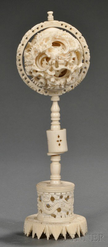 Ivory Puzzle Ball and Stand, China, 19th century, : Ivory Puzzle Ball and Stand, China, 19th century, the stand carved and pierced with a dragons, the sphere on top rendered in similar fashion revealing concentric spheres inside, ht. 8 5/8 in.