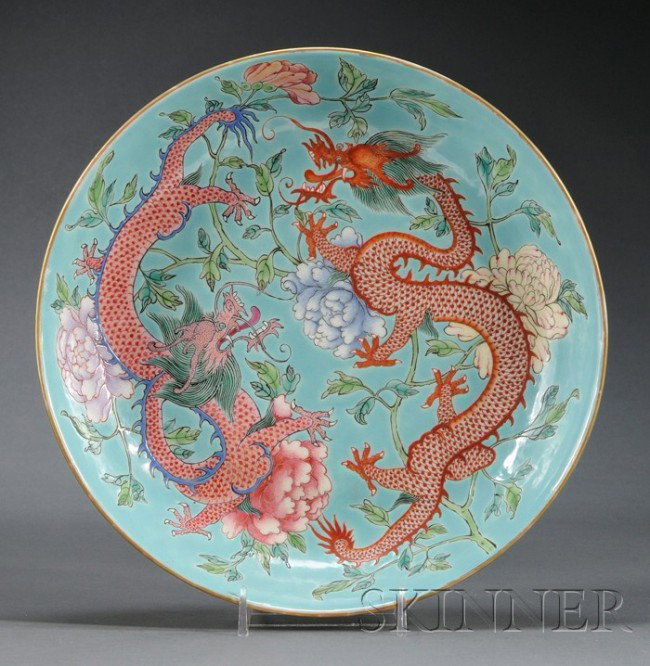 Porcelain Plate, China, 19th century, the interior: Porcelain Plate, China, 19th century, the interior decorated with two dragons striding amidst peony scrolls, reserved on a turquoise ground, four bats in iron red color to the exterior, Jiaqing mark t
