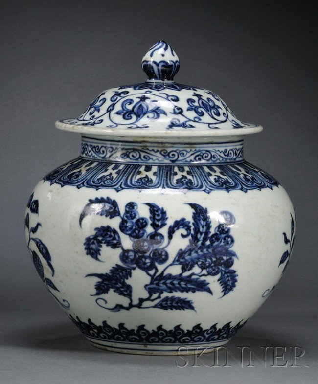 Blue and White Covered Jar, China, 19th century, t: Blue and White Covered Jar, China, 19th century, the bulbous body painted in underglaze blue simulating "heaping and piling" effect with pomegranate, lychee, loquat, and peach sprays, between ruyi and