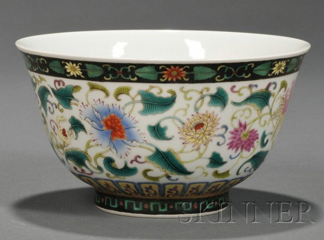 Famille Verte Bowl, China, the deep bowl with slig: Famille Verte Bowl, China, the deep bowl with slightly flaring sides, the exterior finely painted with a multitude of flower sprays borne on leafy meanders, apocryphal Yongzheng mark to the base, dia.
