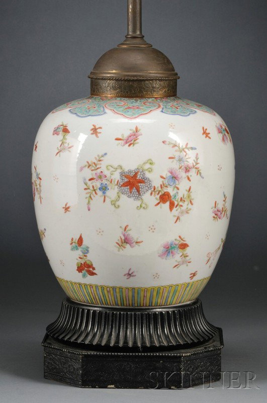 Famille Rose Jar, China, 19th century, the ovoid j: Famille Rose Jar, China, 19th century, the ovoid jar painted with a multitude of floral sprays, under a band of turquoise glazed collar lappets, mounted as a lamp, ht. 9, 28 1/4 in. (overall).