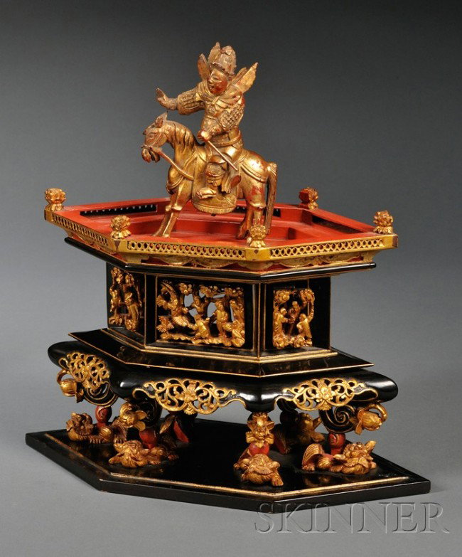 Gilt and Lacquered Wood Display Stand, China, late: Gilt and Lacquered Wood Display Stand, China, late 19th/early 20th century, elongated hexagonal form, supported by foo dog feet, together with a gilt-lacquered wood figure of Guan Yu on horseback, ht.