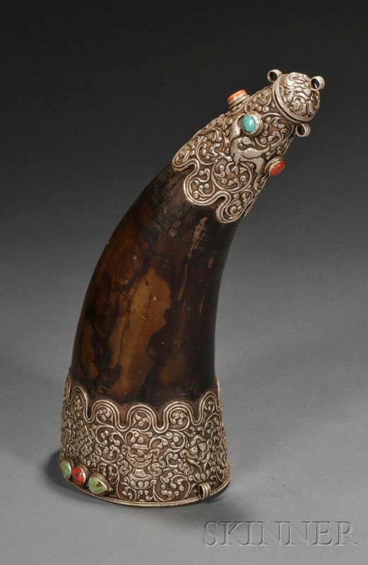 Powder Horn, Tibet, the horn mounted in silver and: Powder Horn, Tibet, the horn mounted in silver and embellished with coral and turquoise beads, with design of dragons and Buddhist treasures, lg. 13 in.