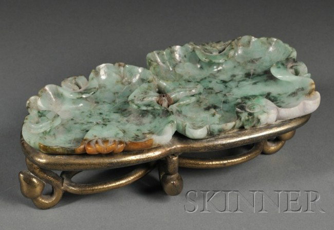 Jade Brush Washer, China, 19th century, carved as : Jade Brush Washer, China, 19th century, carved as two connected lotus leaves, set on a brass mount, the jade of emerald green color with russet, dark green, and lavender inclusions, lg. 6 in.