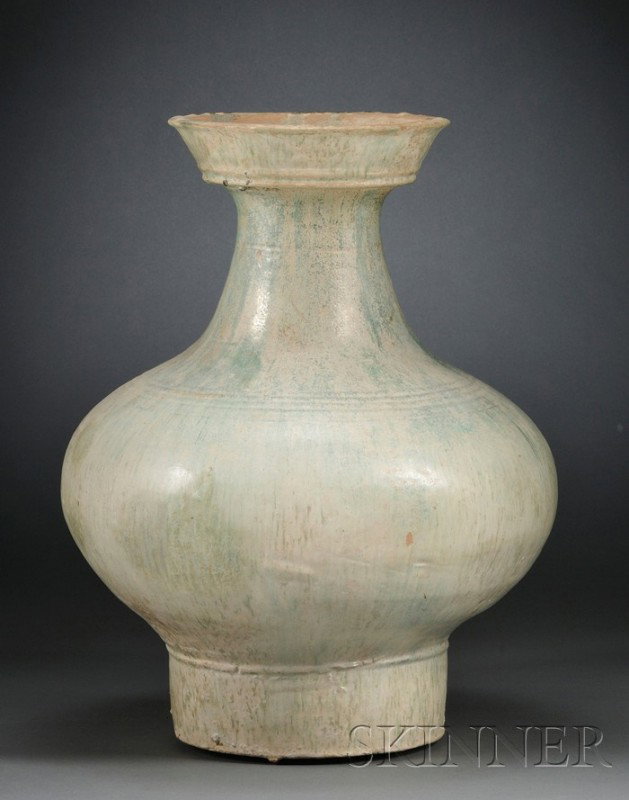 Large Green Glazed Pottery Wine Jar, China, Han d: Large Green Glazed Pottery Wine Jar, China, Han dynasty (206 B.C.–220 A.D.), the compressed globular body supported on a cylindrical foot and surmounted by a tapering neck and a plate-shaped mouth, 