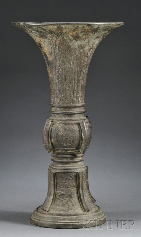 Bronze Vase, China, 18th century, beaker form, gu: Bronze Vase, China, 18th century, beaker form, gu shaped with rounded sides and flanges with archaic panels of taotie masks and cicadas, ht. 18 1/2 in.