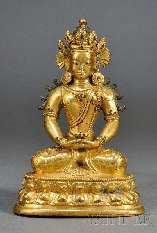 Gilt-bronze Buddha, China, 19th century, seated f: Gilt-bronze Buddha, China, 19th century, seated figure of Amitayus on a double-lotus throne, wearing crested headpiece and large rosette earring, his two palms facing up, finely incised patterns to hi