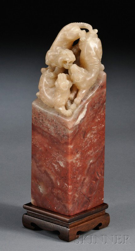 Large Soapstone Seal, China, the rectangular lowe: Large Soapstone Seal, China, the rectangular lower section of red color, surmounted by a top section of yellow-celadon color carved as a tiger group, lg. 7 in.