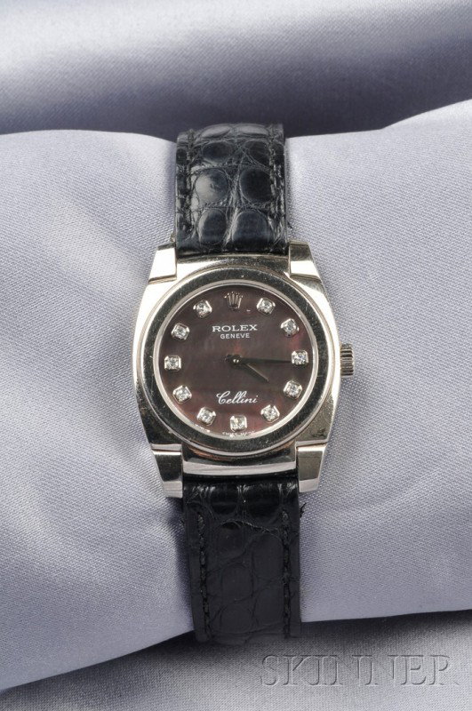 18kt White Gold "Cellini" Wristwatch, Rolex, the b: 18kt White Gold "Cellini" Wristwatch, Rolex, the black mother-of pearl dial with diamond indicators, enclosing a 20-jewel manual wind movement, case no. 5310, A997163, completed by crocodile strap.
