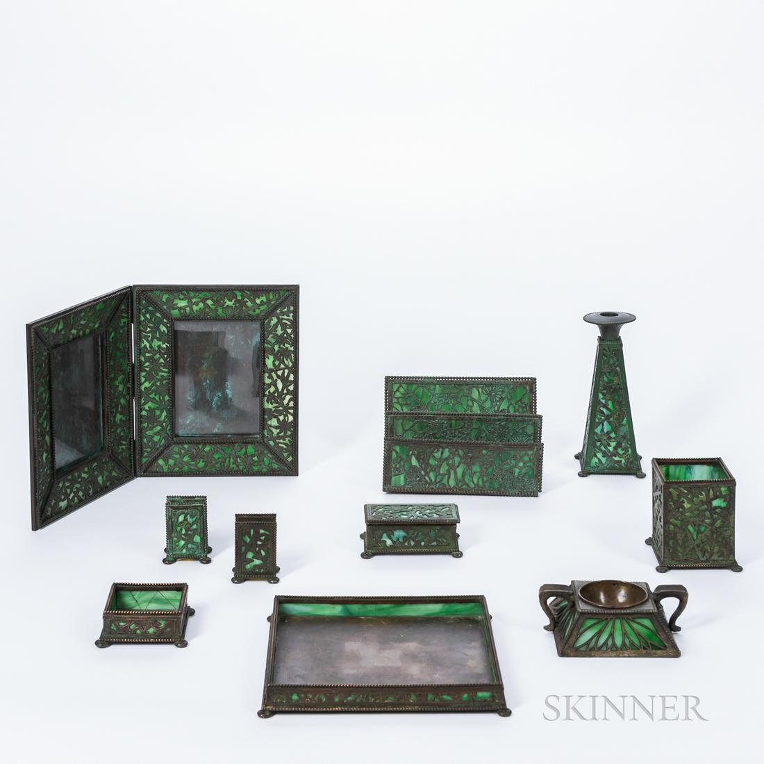 Ten-piece Apollo Studios Floral Pattern Desk Set, New: Ten-piece Apollo Studios Floral Pattern Desk Set, New York, early 20th century, bronze overlay, slag glass, and copper, some stamp marked "Apollo Studios New York," letter rack, ht. 5 1/2, square tray