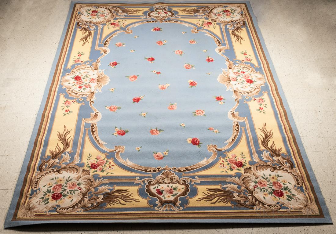 Edward Fields Tufted Wool Carpet, early 21st century,: Edward Fields Tufted Wool Carpet, early 21st century, blue main field with scattered rose blossoms, border with sprays of roses set in cartouches, maker's ink stamp, 13 1/2 x 19 1/2 ft.