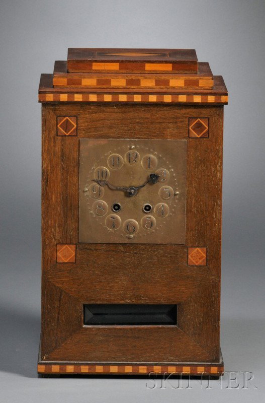 Arts & Crafts Mantel Clock Copper and inlaid oak G: Arts & Crafts Mantel Clock Copper and inlaid oak Germany, early 20th century Stepped rectangular top on oak case with contrasting geometric wood inlay designs and borders, embossed copper clock dial w
