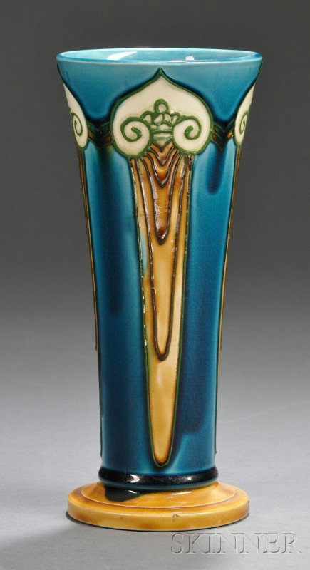 Minton Art Nouveau Vase Glazed art pottery England: Minton Art Nouveau Vase Glazed art pottery England, early 20th century Tapered body on a round base, decorated with elongated scroll and drapery devices in relief in green and tan on a glossy blue-gre