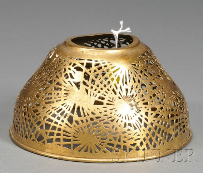 Tiffany Studios Shade Dore metal New York, early 2: Tiffany Studios Shade Dore metal New York, early 20th century Reticulated domed shade in the Pine needle pattern, impressed mark, aperture dia. 2, shade 6 1/4, ht. 3 1/2 in.