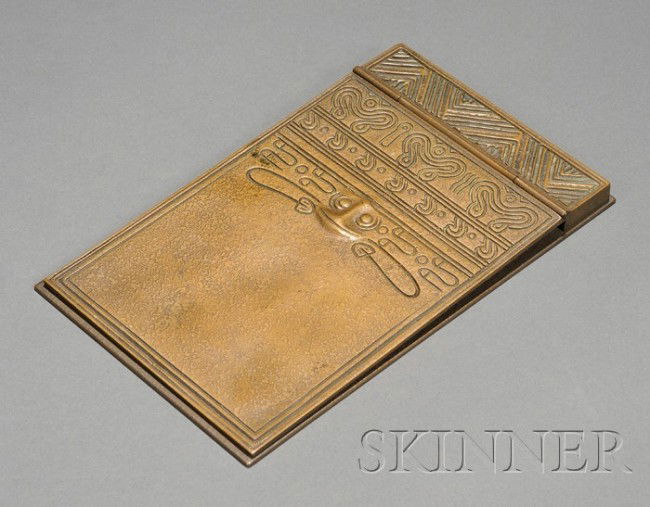 Tiffany Studios Indian Pattern Note Holder Bronze: Tiffany Studios Indian Pattern Note Holder Bronze dore New York, early 20th century Two hinged plates accompanied by an American Malting Co. notepad, New York, note holder marked Tiffany Studios New Y