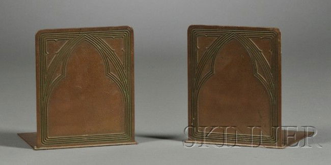 Pair of Tiffany Studios Gothic Bookends Bronze met: Pair of Tiffany Studios Gothic Bookends Bronze metalwork New York, early 20th century Rectangular forms with linear decoration in the form of a Gothic arch, marked Tiffany Studios New York 1007, ht. 5