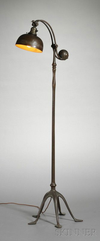 Tiffany Studios Counterbalance Floor Lamp Bronze N: Tiffany Studios Counterbalance Floor Lamp Bronze New York, early 20th century Domed bronze shade with decorative border over single socket with counterbalance adjusts, cylindrical stem raised on four