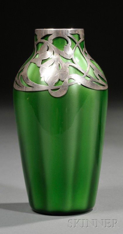 Loetz Metallin Art Glass Vase with Silver Overlay: Loetz Metallin Art Glass Vase with Silver Overlay Art glass and silver Austria, 1905-1920 Green paperweight style ribbed ovoid form with silver floral decoration at neck and shoulder, ht. 6 1/2 in. No