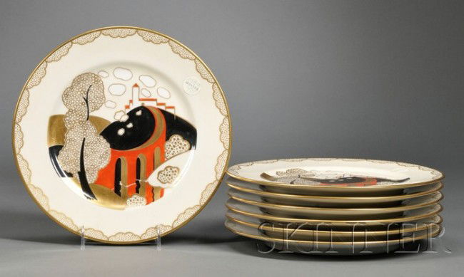 J. Bernardaud & Co. Seven decorated porcelain dinn: J. Bernardaud & Co. Seven decorated porcelain dinner plates Limoges, France Decorated in the center with a building on a hill, arched bridge, tree and shrubbery in red, black, white, and gilt on a cre