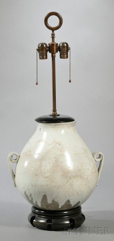Pottery Table Lamp Glazed earthenware Fourth quart: Pottery Table Lamp Glazed earthenware Fourth quarter 20th century Loop finial over two sockets on large bulbous base with two applied handles in faux crackle white glaze raised on circular wooden base
